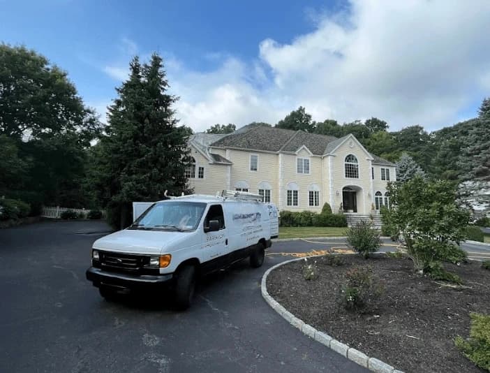 North Olmsted Power Washing technician performing thorough gutter cleaning service in North Olmsted