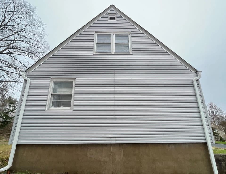 North Olmsted Power Washing technician performing detailed house washing in North Olmsted residential area